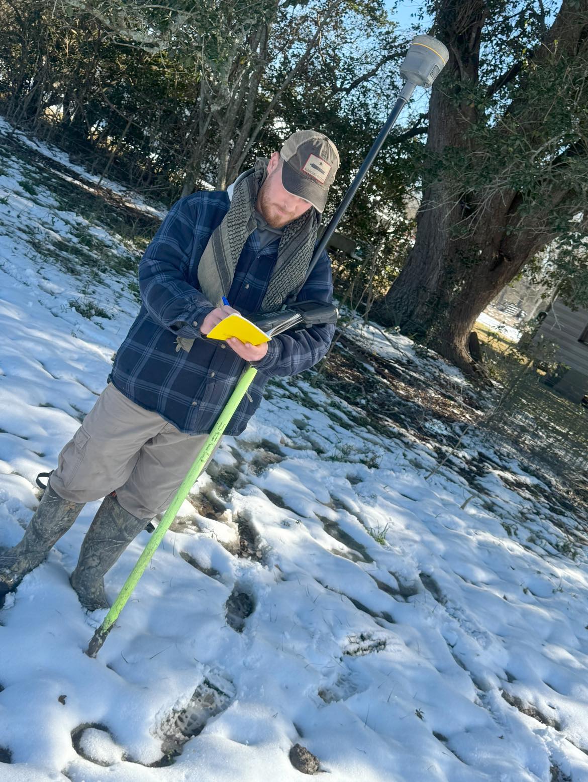 Surveyor taking field notes